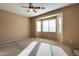 Bright bedroom with ceiling fan and carpet at 18473 W Piedmont Rd, Goodyear, AZ 85338