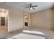 Bedroom with carpet, ceiling fan and access to bathroom at 18473 W Piedmont Rd, Goodyear, AZ 85338