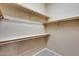 Large walk-in closet with ample shelving and hanging space at 18473 W Piedmont Rd, Goodyear, AZ 85338