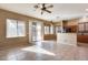 Kitchen and dining area with tile floors and sliding door to patio at 18473 W Piedmont Rd, Goodyear, AZ 85338