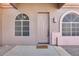 Front entry with arched windows and a welcoming doormat at 18473 W Piedmont Rd, Goodyear, AZ 85338