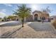 Front yard view of a single-story home with a gravel driveway at 18473 W Piedmont Rd, Goodyear, AZ 85338