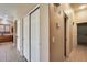 Home hallway with double door closets and tile floor at 18473 W Piedmont Rd, Goodyear, AZ 85338