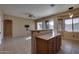 Kitchen with island and view into living room at 18473 W Piedmont Rd, Goodyear, AZ 85338