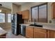 Kitchen with stainless steel appliances and wood cabinets at 18473 W Piedmont Rd, Goodyear, AZ 85338