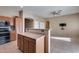 Open kitchen with island and stainless steel appliances at 18473 W Piedmont Rd, Goodyear, AZ 85338