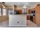 Spacious kitchen with island, stainless steel appliances, and wood cabinets at 18473 W Piedmont Rd, Goodyear, AZ 85338