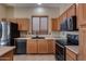 Kitchen with stainless steel appliances and wood cabinets at 18473 W Piedmont Rd, Goodyear, AZ 85338