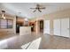 Open living room and kitchen area with tile floors at 18473 W Piedmont Rd, Goodyear, AZ 85338