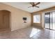 Living room with sliding glass door to patio at 18473 W Piedmont Rd, Goodyear, AZ 85338