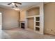 Living room with fireplace and built-in shelving at 18473 W Piedmont Rd, Goodyear, AZ 85338