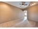 Bright living room with tile and carpeted floors at 18473 W Piedmont Rd, Goodyear, AZ 85338