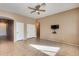 Living room with ceiling fan and tile flooring at 18473 W Piedmont Rd, Goodyear, AZ 85338