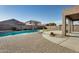 Inviting backyard with a sparkling pool and patio at 18473 W Piedmont Rd, Goodyear, AZ 85338