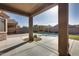 Covered patio overlooking a sparkling pool and grassy area at 18473 W Piedmont Rd, Goodyear, AZ 85338