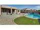 Relaxing backyard oasis with a kidney shaped pool at 18473 W Piedmont Rd, Goodyear, AZ 85338