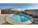 Kidney-shaped pool with surrounding patio at 18473 W Piedmont Rd, Goodyear, AZ 85338