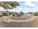 Landscaped backyard with a curved walkway and gravel at 19806 N Stardust Blvd, Sun City West, AZ 85375