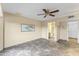 Bedroom with ceiling fan and access to bathroom at 19806 N Stardust Blvd, Sun City West, AZ 85375