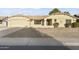 Ranch style home with a two-car garage and nicely landscaped yard at 19806 N Stardust Blvd, Sun City West, AZ 85375