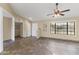 Bright and airy living room with tile floors and a ceiling fan at 19806 N Stardust Blvd, Sun City West, AZ 85375