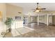 Bright living room with tile floors and a ceiling fan at 19806 N Stardust Blvd, Sun City West, AZ 85375