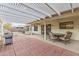 Covered patio with table and chairs, perfect for outdoor dining at 19806 N Stardust Blvd, Sun City West, AZ 85375