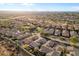 Aerial view of community featuring numerous homes and desert landscape at 2129 N Atwood --, Mesa, AZ 85207