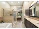 Elegant bathroom with a large shower, soaking tub, and double vanity at 2129 N Atwood --, Mesa, AZ 85207