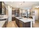 Modern kitchen featuring stainless steel appliances and an island with seating at 2129 N Atwood --, Mesa, AZ 85207