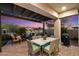 Covered patio with seating area, dining table, and grill at 2129 N Atwood --, Mesa, AZ 85207