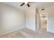 Spacious bedroom with ceiling fan and access to additional rooms at 21655 N 36Th Ave # 106, Glendale, AZ 85308