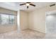 Bedroom with ceiling fan and window at 21655 N 36Th Ave # 106, Glendale, AZ 85308