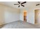 Spacious bedroom with ceiling fan and carpeted floors at 21655 N 36Th Ave # 106, Glendale, AZ 85308