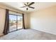 Bedroom with balcony access and mountain views at 21655 N 36Th Ave # 106, Glendale, AZ 85308