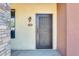 Front entry door with an ornate security screen door at 21655 N 36Th Ave # 106, Glendale, AZ 85308