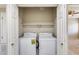 Laundry room with washer and dryer in a closet at 21655 N 36Th Ave # 106, Glendale, AZ 85308