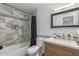 Bathroom with tub, shower, and wooden vanity at 225 N Standage -- # 122, Mesa, AZ 85201