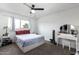 Bright bedroom featuring a bed, dresser, and window at 225 N Standage -- # 122, Mesa, AZ 85201