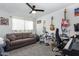 Bedroom with couch, musical instruments, and workspace at 225 N Standage -- # 122, Mesa, AZ 85201