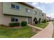 View of townhome building, showing landscaping and walkway at 225 N Standage -- # 122, Mesa, AZ 85201