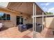 Relaxing patio with covered seating area, string lights, and fire pit at 225 N Standage -- # 122, Mesa, AZ 85201