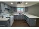 Modern kitchen with gray cabinets and white countertops at 236 S 2Nd St, Avondale, AZ 85323