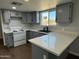 Modern kitchen with gray cabinets and white countertops at 236 S 2Nd St, Avondale, AZ 85323