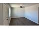 Bright living room with gray walls and dark wood floors at 236 S 2Nd St, Avondale, AZ 85323