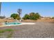 Large backyard with gravel landscaping and a swimming pool at 2407 E Encanto St, Mesa, AZ 85213