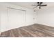 Bright bedroom with double door closet and wood floors at 2407 E Encanto St, Mesa, AZ 85213