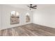 Bedroom with wood-look floors and arched windows at 2407 E Encanto St, Mesa, AZ 85213