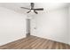 Simple bedroom with wood-look floors and ceiling fan at 2407 E Encanto St, Mesa, AZ 85213