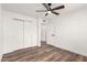 Bedroom with double door closet and wood floors at 2407 E Encanto St, Mesa, AZ 85213